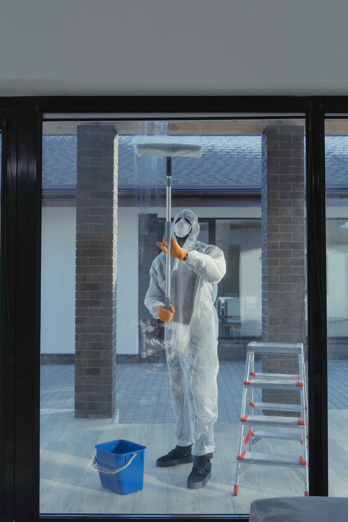 Man Cleaning Glass Window